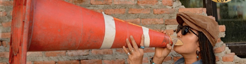 Woman using cone to shout loudly